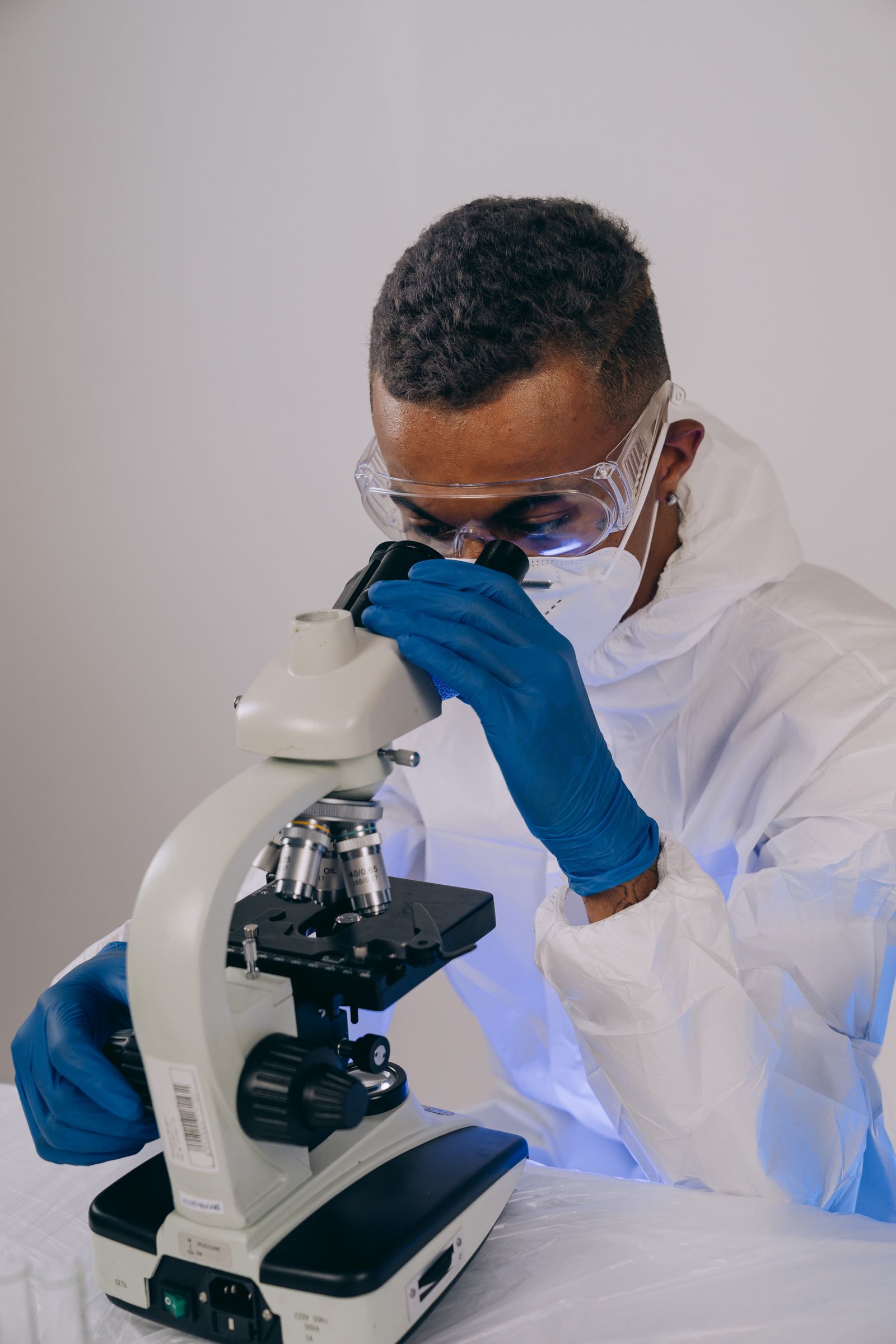 A scientist at a microscope